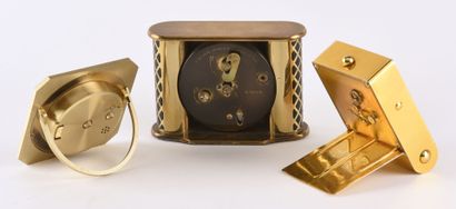 null Set of three travel alarm clocks: 

- YEMA alarm clock in gilt brass on quartz...