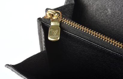 LOUIS VUITTON Black epi leather wallet. 

Compartmented interior with zippered pocket....