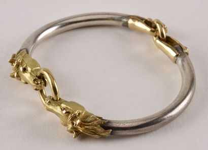 null Bracelet rigide ouvrant en or jaune 18K ( 750 millièmes) et argent ( 925 millièmes)...