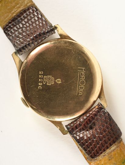 HERODIA Bracelet montre en or jaune 18k (750 Millièmes). 

Cadran rond, index bâtons...