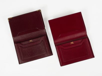 HERMES Suite de trois portefeuilles en cuir, intérieur composé de différentes poches...