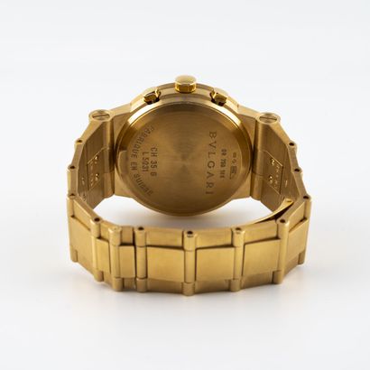 BULGARI Montre-bracelet chronographe en or (750). 

Cadran blanc, index appliques...