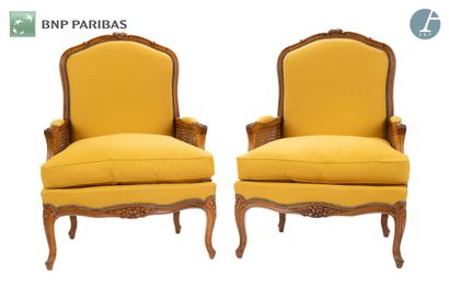 null Pair of bergères in molded and carved natural wood. Caned armrests. The upholstery...