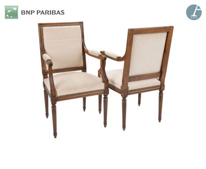 null Suite of two armchairs in molded and carved natural wood, upholstered with a...