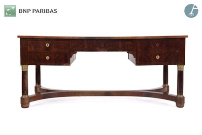 null A natural wood and mahogany veneer desk, opening with five drawers in the waist...