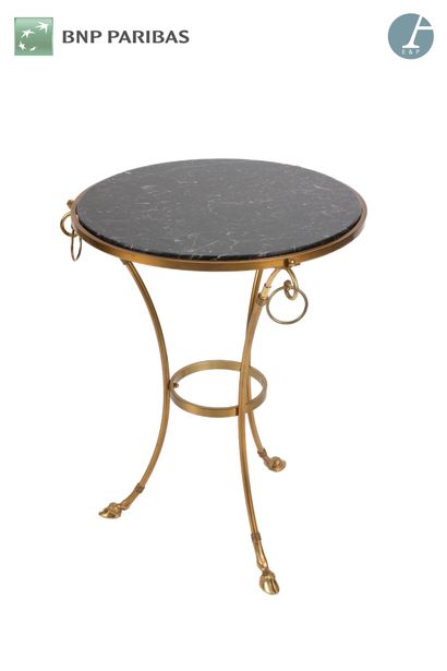 null Gilt bronze tripod pedestal table, the feet ended by sabots and joined by a...