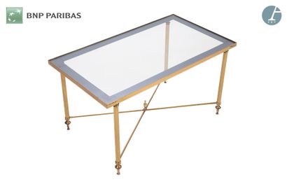 null Rectangular brass coffee table, the fluted legs ending in spinning tops decorated...