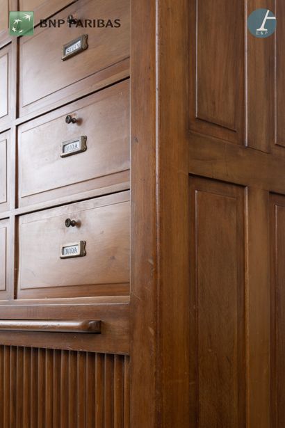 null American" style notary's cabinet in molded and carved natural wood, closed by...