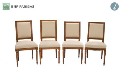 null Suite of four chairs in molded and carved natural wood. Tapered legs with flutes....