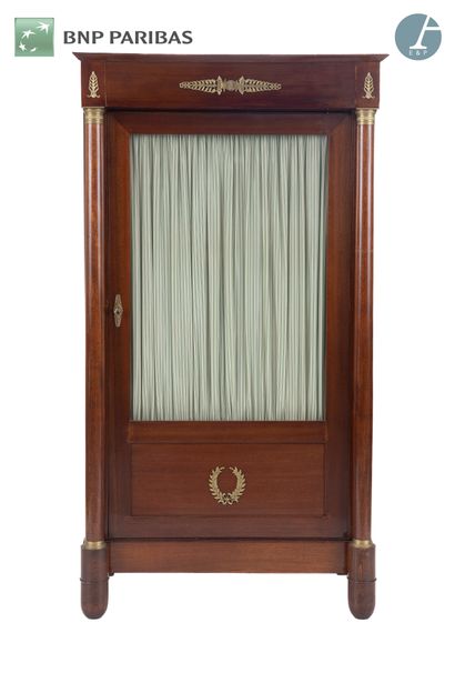 null Mahogany bookcase with detached columns, opening to a glass door; (replacements...