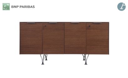 null Four-door credenza opening on two single shelves 
Chromed legs, black lacquered...