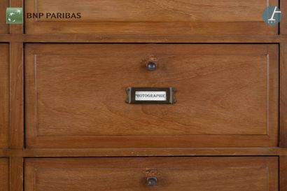 null American" style notary's cabinet in molded and carved natural wood, closed by...