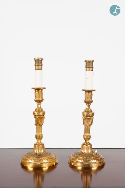 null 
From a prestigious Parisian Palace 


Pair of chased and gilded bronze torches,...