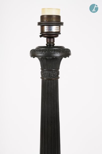 null 
From a prestigious Parisian Palace 


Bronze lamp base with black patina, the...