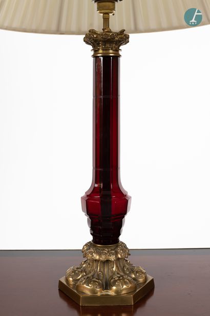 null 
From a prestigious Parisian Palace 


Gilt bronze lamp with a baluster shaft...