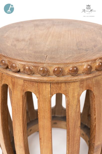 null 
Lot including a circular openwork stool in natural wood, decorated with a frieze...
