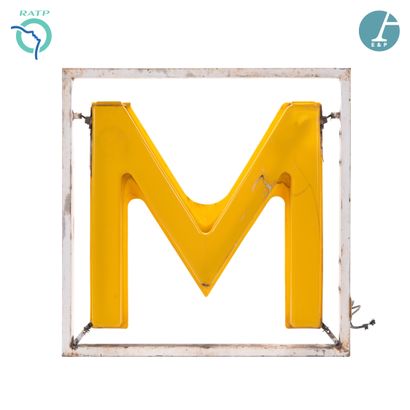  M in yellow plastic, backlit by neon, in its original frame in white lacquered metal....