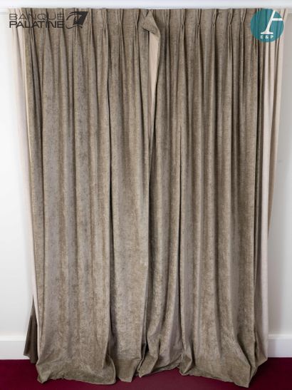 A pair of large grey and beige curtains....