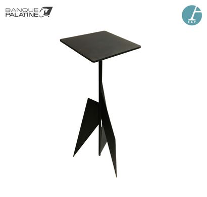Tripod pedestal in black lacquered metal....