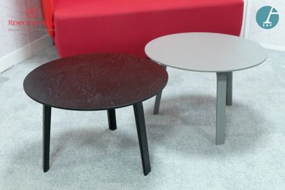 null Set of two small circular coffee tables, one in black stained wood and the other...