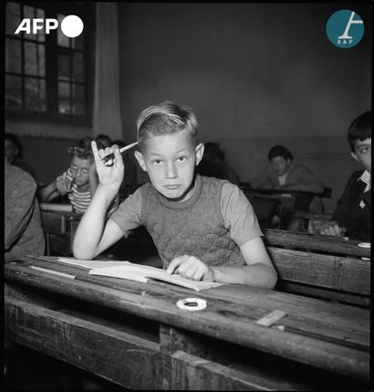 null 
AFP


French schoolchildren in an elementary school classroom on the first...