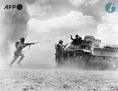 null AFP

A Wehrmacht tank surrenders to British soldiers in the North African desert....