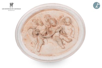 null From the Sources de Caudalie
Pair of terracotta medallions, decorated with putti...