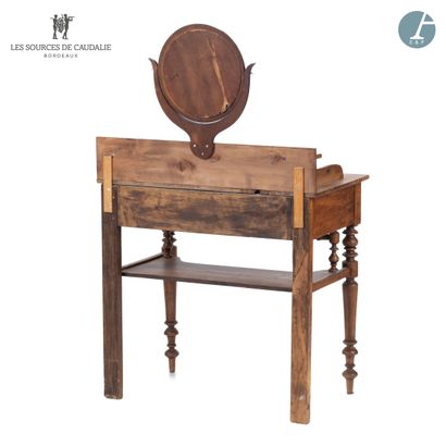 null From the Sources de Caudalie
Dressing table in natural wood, opening with a...