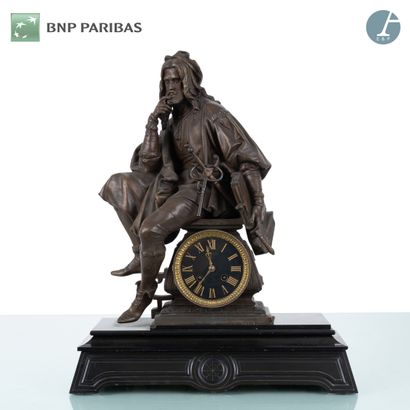 Clock in patinated bronze representing an...