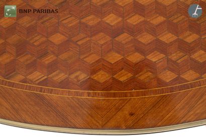 null Coffee table in marquetry and gilt bronze, the oval tray resting on cambered...