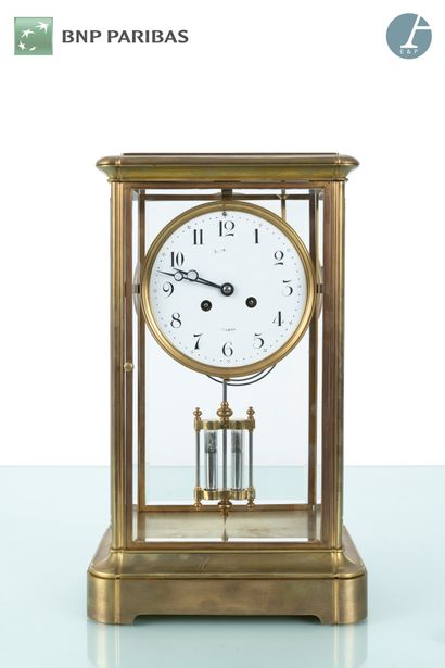 null Glass and brass clock, the dial with Arabic numerals (illegible signature);...
