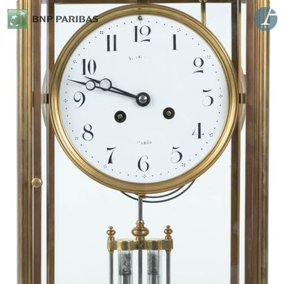 null Glass and brass clock, the dial with Arabic numerals (illegible signature);...