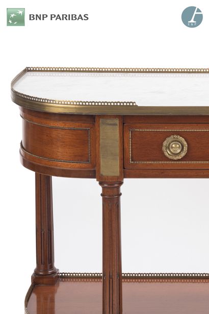 null Mahogany console of half-moon shape, with four uprights joined by a spacer;...