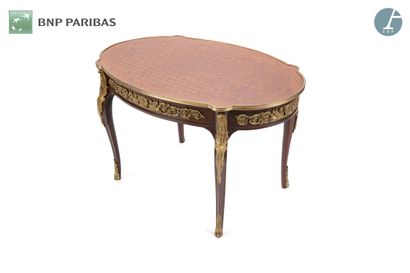 null Coffee table in marquetry and gilt bronze, the oval tray resting on cambered...