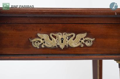 null Flat desk in molded and carved mahogany, opening with three drawers in the belt,...