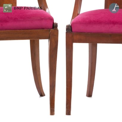 null Suite of four cabriolet chairs in molded and carved natural wood. The openwork...