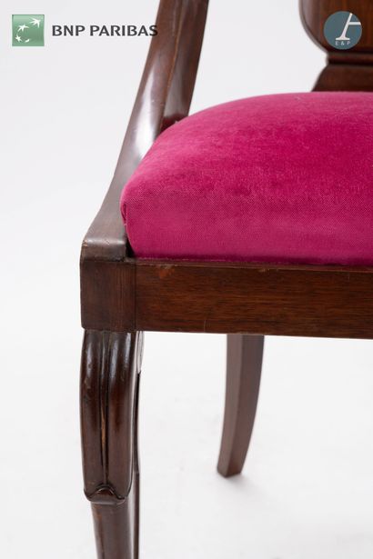 null Series of four gondola chairs in molded and carved mahogany. The seat in burgundy...