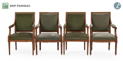 Suite of four armchairs in natural wood molded...