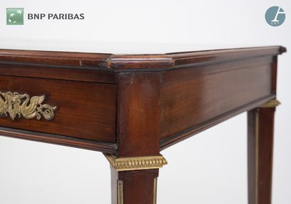 null Flat desk in molded and carved mahogany, opening with three drawers in the belt,...