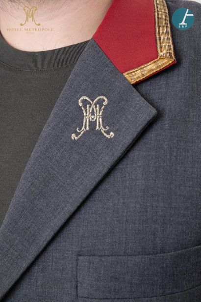 null From the Hotel Metropole (Brussels): 
Dark gray and red valet jacket, gold embroidered...