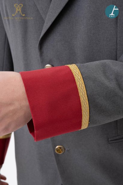 null From the Hotel Metropole (Brussels): 
Dark gray and red valet jacket, gold embroidered...