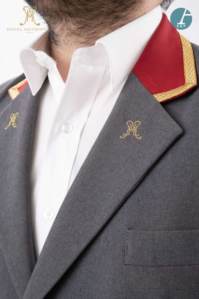 null From the Hotel Metropole (Brussels): 
Grey and red valet jacket, gold embroidered...