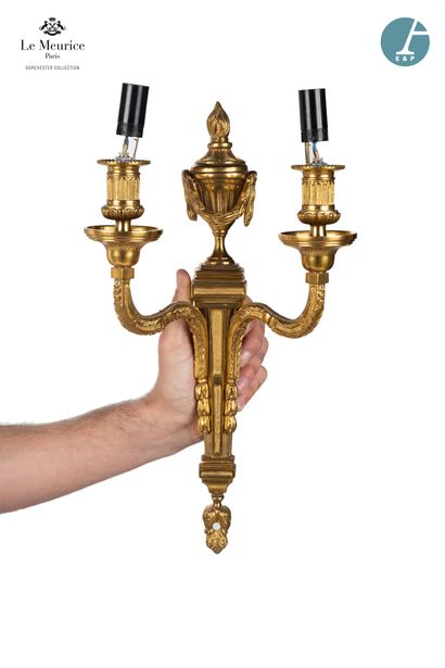 null From the Hôtel Le Meurice.
Pair of two-arm sconces in chased and gilded bronze,...