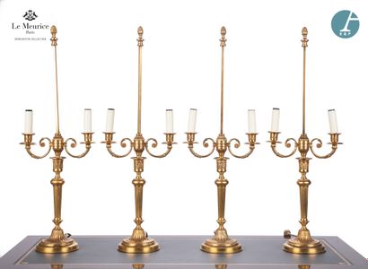 null From Hôtel Le Meurice.
Set of four ormolu lampstands, with two scrolled light...