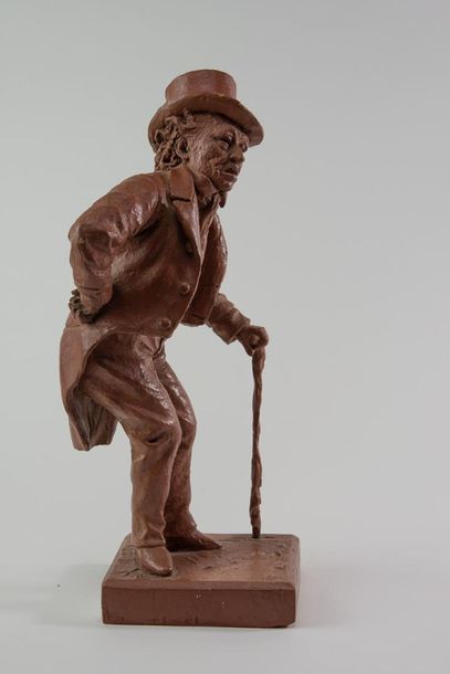 null XIXth SCHOOL. "Old man with a frock coat" Terracotta relayed. H: 37 cm. Small...