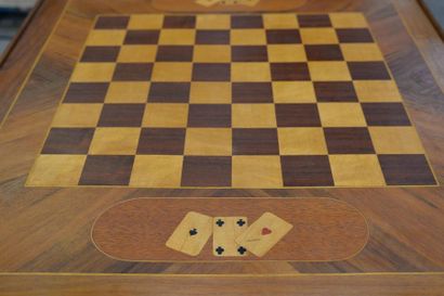 null GAME TABLE in marquetry resting on four slightly curved feet and opening by...