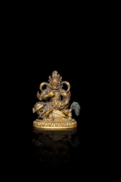 null TIBET- XIXe/XXe siècle

Groupe en bronze doré, Vaishravana assis sur son lion,...