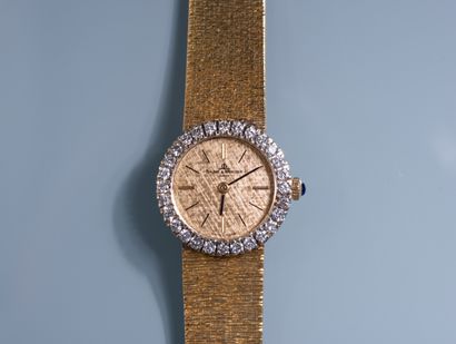 null BAUME ET MERCIER. Lady's wristwatch with 18K yellow gold case and bracelet....
