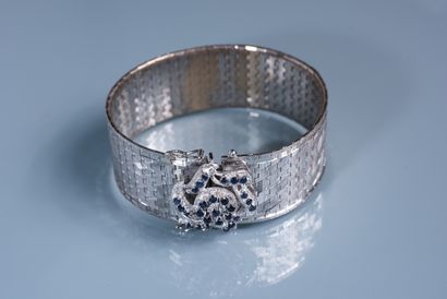 null LARGE FLEXIBLE BRACELET in 18 ct white gold with a rose pattern set with small...