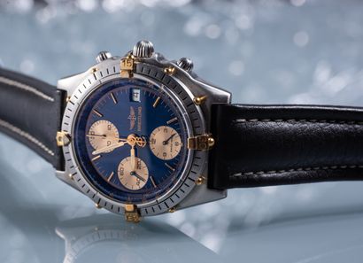 null BREITLING. Men's steel CHRONOGRAPHIC WATCH. Blue dial with triple counters and...